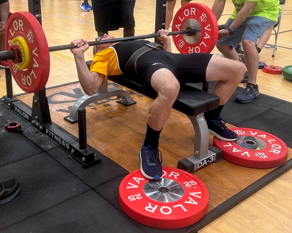 A Special Olympics athlete lifts heavy during the ‘Powerlifting’ competition.
