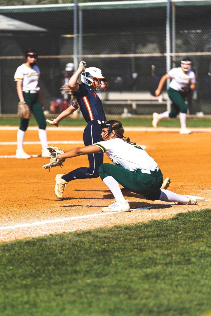 Eighth-grader Riley Jaquish prepares to catch the ball and make a tag at third base. The softball team lost 12-7 on April 2nd to Bradenton Christian.