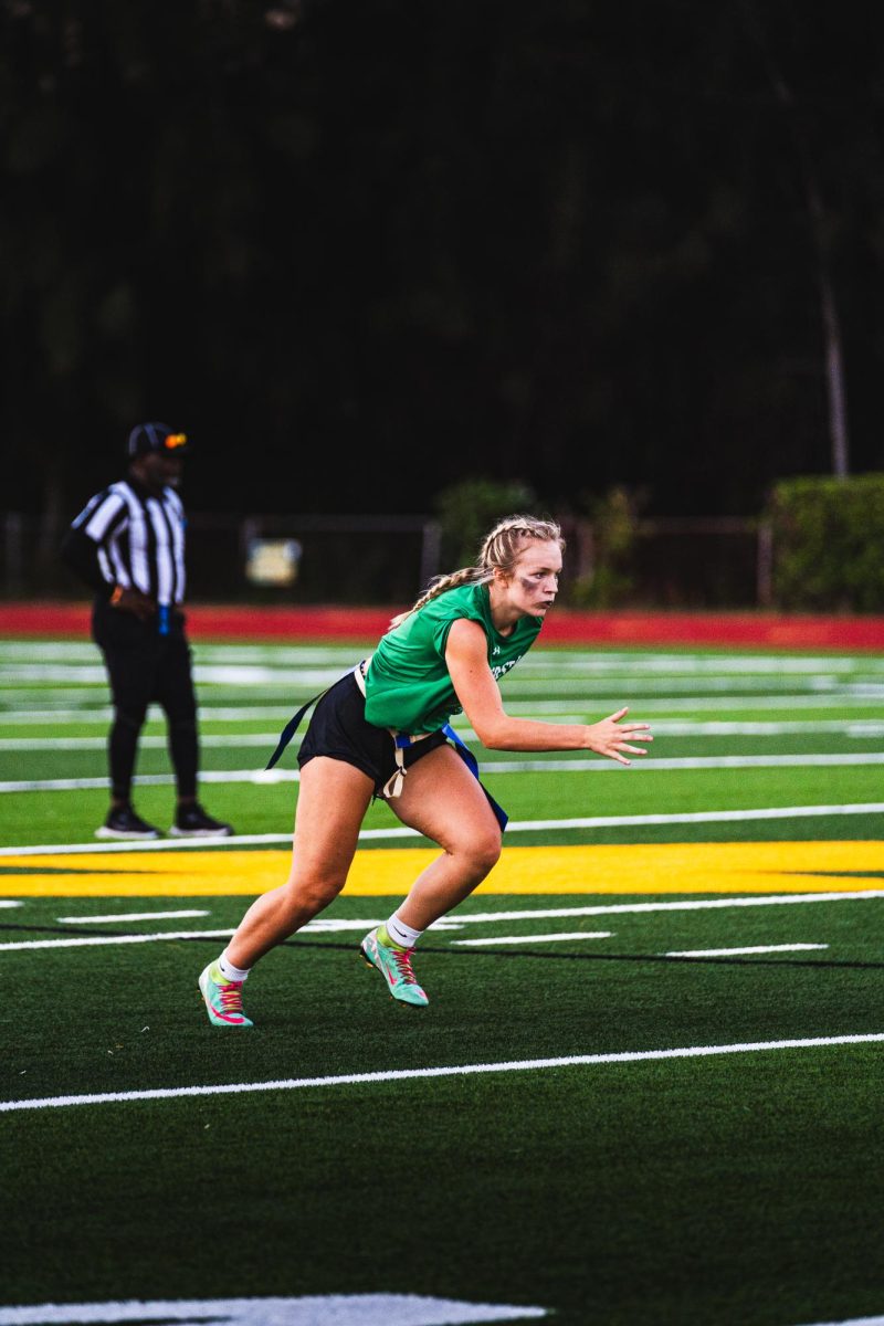 Senior Maddie Needler sprints after the ball in the flag football team’s game against Berkeley Prep. This was their first game on the new field. They lost 13-6. 