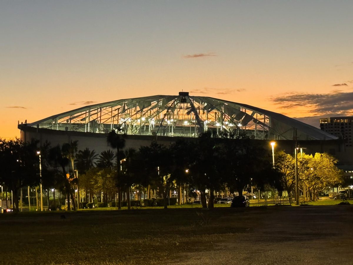 Tropicana Field’s roof shredded due to winds during Hurricane Milton. The Teflon-coated fiberglass roof was built to sustain 100-mile per hour winds, but fell apart during Milton’s Category 3 effects. The roof would cost millions to repair, and the Tamps Bay Rays are in the process of deciding whether to repair it or to relocate to a new ballpark for the next season. Photo by Reece Campbell.