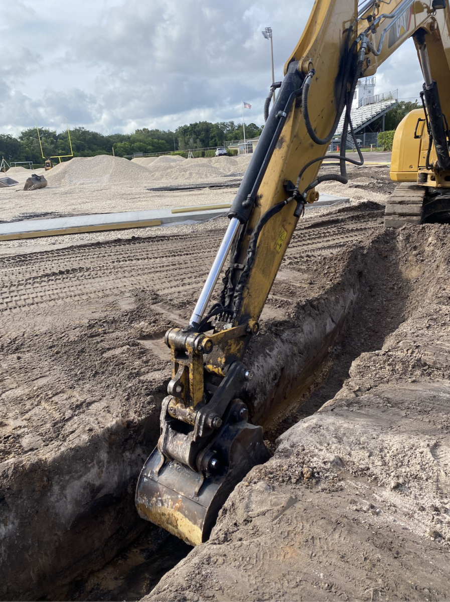 A bulldozer starts digging up the track surrounding Haskell Field. The track is used by a variety of sports such as Cross Country and Track and Field. Photo by Mila Bianco.
