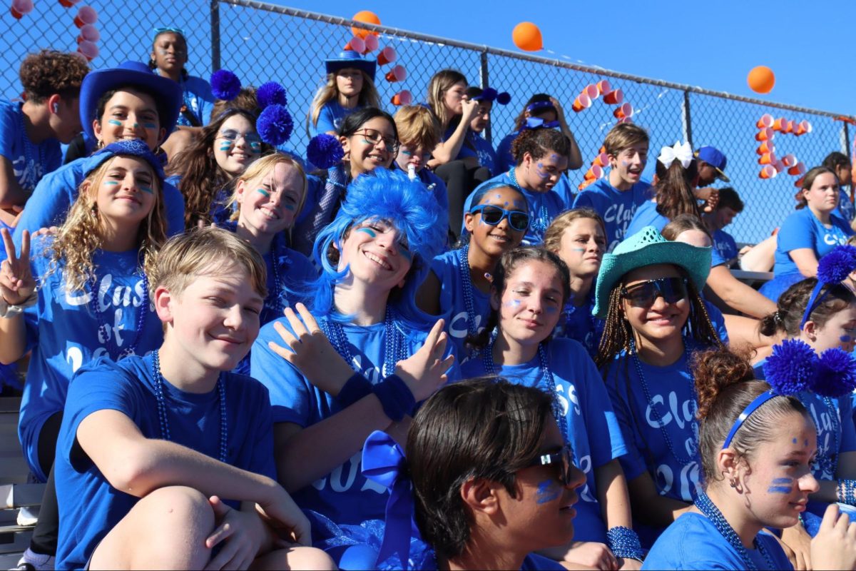 Freshmen watch the events of their first Class Competition day unfold. When asked her opinion on her first homecoming experience, freshman Hazel Needler said, “Being a part of it this year was so much fun. The day went by so fast, and I’m so grateful I go to a school that does this.”