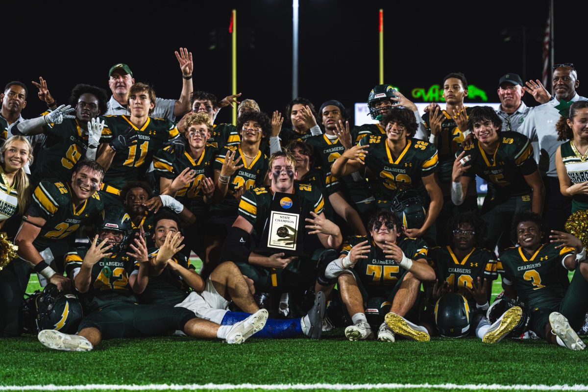 The Shorecrest varsity football team celebrates their 2024 State Championship victory with a team photo. On November 14th, with a dominant performance against Countryside, the team secured their fourth consecutive title.