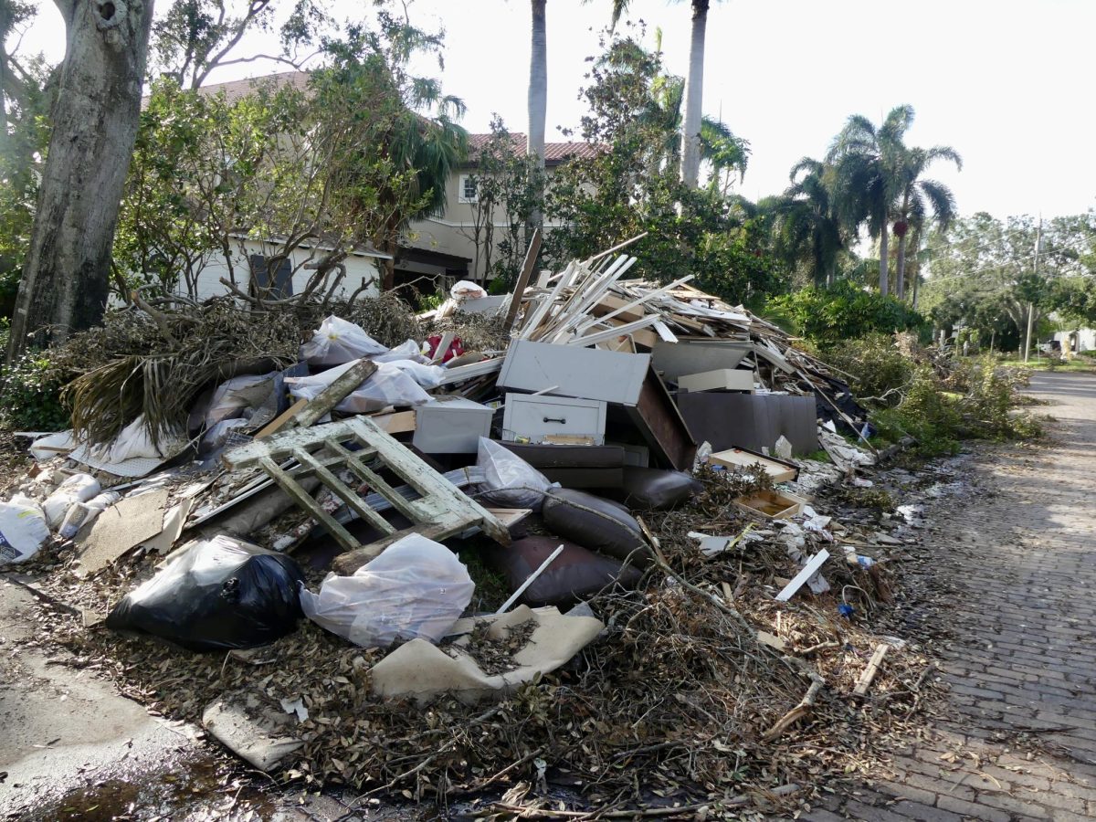 Ruined items and debris sit outside of a home on Coffee Pot Riviera in Snell Isle. This specific house had all of its furniture ruined due to flooding and will likely be knocked down in the near future. 