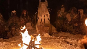 Showtime's Yellowjackets pilot episode opens with a foreshadowing of what the Yellowjackets soccer team becomes after 19 months in the wilderness. The girls sit around a fire, wearing animal masks that hide their identities, and cook a mystery girl, who dies in the opening scene. Photo courtesy of The Revealer.
