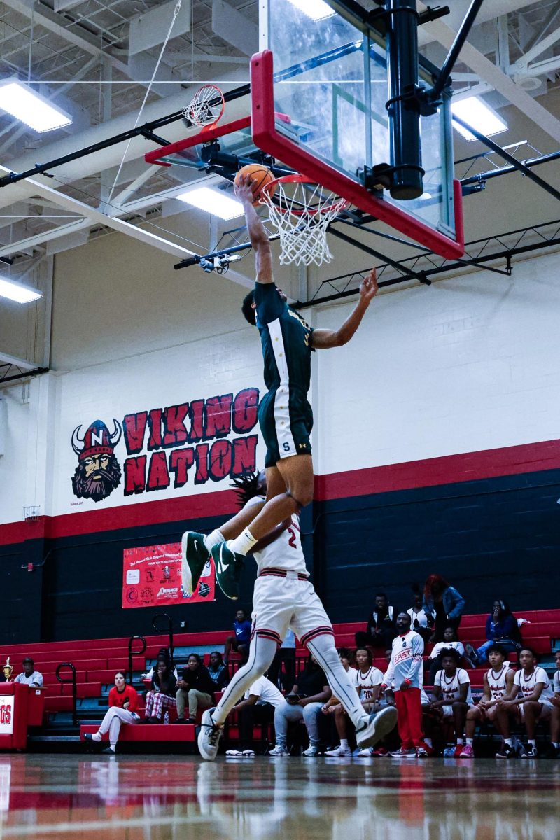 Senior Nick Bearden dunks at an away
varsity boys basketball game against
St. Pete Catholic on December 11,
2024. The Chargers won 67-52.