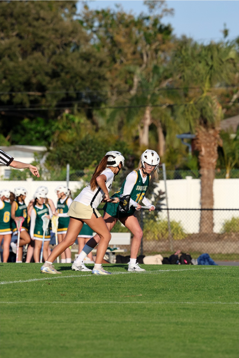 Sophomore Claire James gets ready for the draw in the varsity girls lacrosse game on February 21, 2025 against St. Pete Catholic.