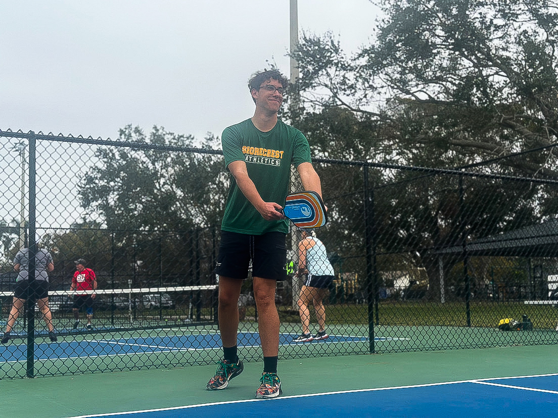 Senior Max Baschinksy plays pickleball at Denver Park in Shore Acres. Baschinksy and many other students play pickleball as a form of exercise and leisure.