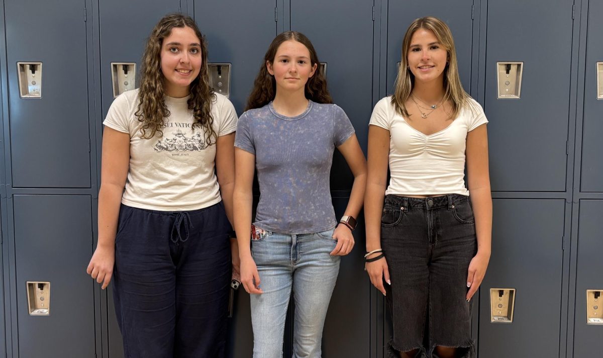 Juniors Alexia Bucci, Arden Katcha, and Gia Bessolo (from left to right) pose after winning an essay contest in US English Teacher Joe Gonzalez's American Literature Honors class.  The class explored the question "What is the status of the American Dream?" in argumentative essays and then voted on the top 3 most persuasive arguments to publish.