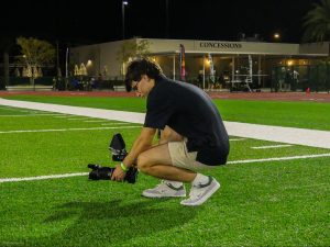 Senior Cole Goldenberg takes photos at the varsity football team’s state championship game in The Villages on November 14th, 2024