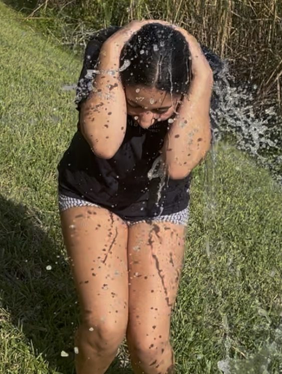 Freshman Natalia Davila participates in the ice bucket challenge and clutches her head as the cold water gets poured all over her. Photo courtesy of Nataila Davila.
