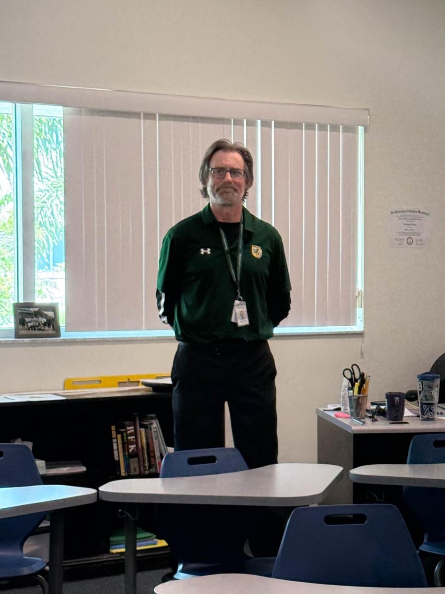 US Health Teacher and Coach Jonathan Tallon standing in his new classroom. Although holding a new position, he is not new to the Shorecrest community as he was a coach for the Middle School girls basketball team in years prior.