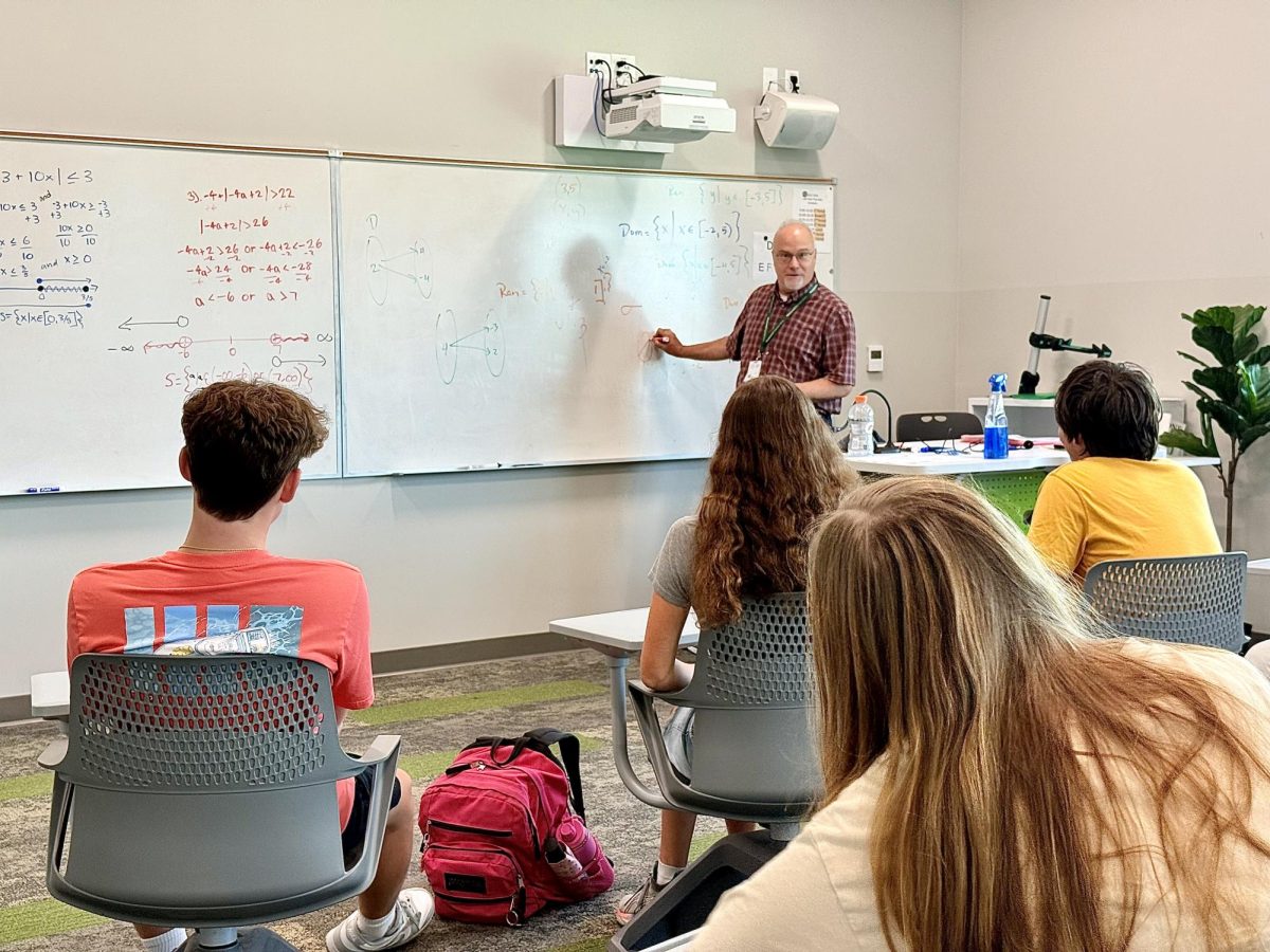 New Upper School Math Teacher Paul McInerney teaches a lesson to one of his AP Statistics classes.