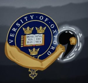 An Oxford Comma alongside the University of Oxford’s coat of arms.