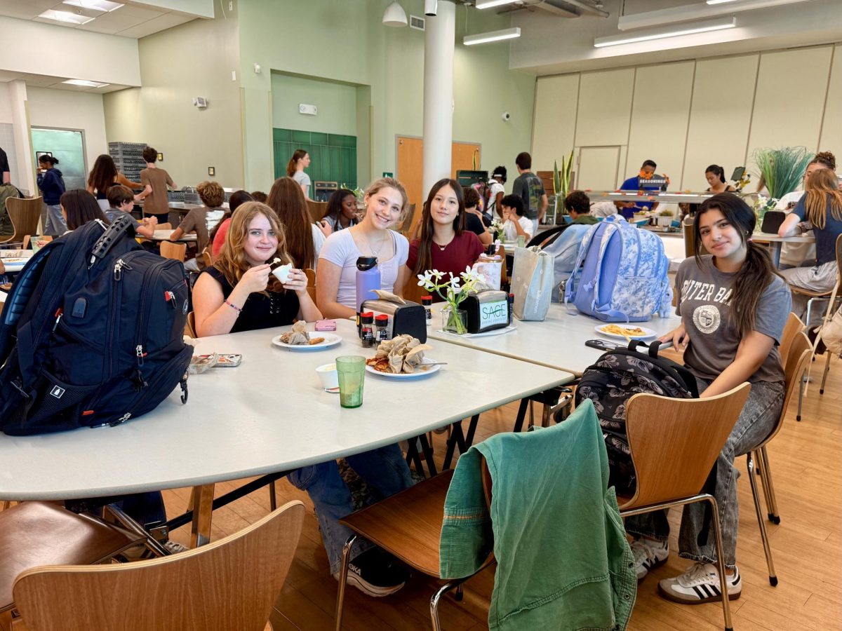 A group of freshman girls (left to right: Scarlett Bedell, Zoe Eichenbaum, Jayden Cove and Shelmy Diaz) sit at a freshman-only lunch table in the Charger Commons cafeteria. Tables have been reserved for underclassmen so they can easily find a place to eat in the crowded cafeteria, where seating is limited to first-come-first-serve.
