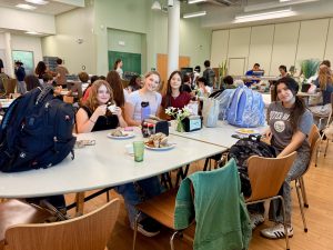 A group of freshman girls (left to right: Scarlett Bedell, Zoe Eichenbaum, Jayden Cove and Shelmy Diaz) sit at a freshman-only lunch table in the Charger Commons cafeteria. Tables have been reserved for underclassmen so they can easily find a place to eat in the crowded cafeteria, where seating is limited to first-come-first-serve.
