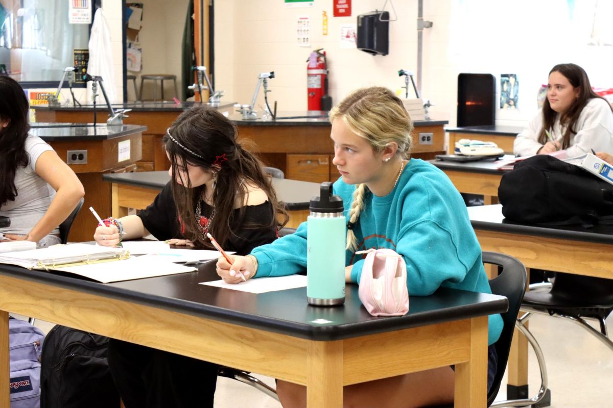 Sophomore Hazel Needler takes notes in her College Prep chemistry class, which will receive a GPA boost next school year. Previously, there was no GPA boost for College Prep classes.