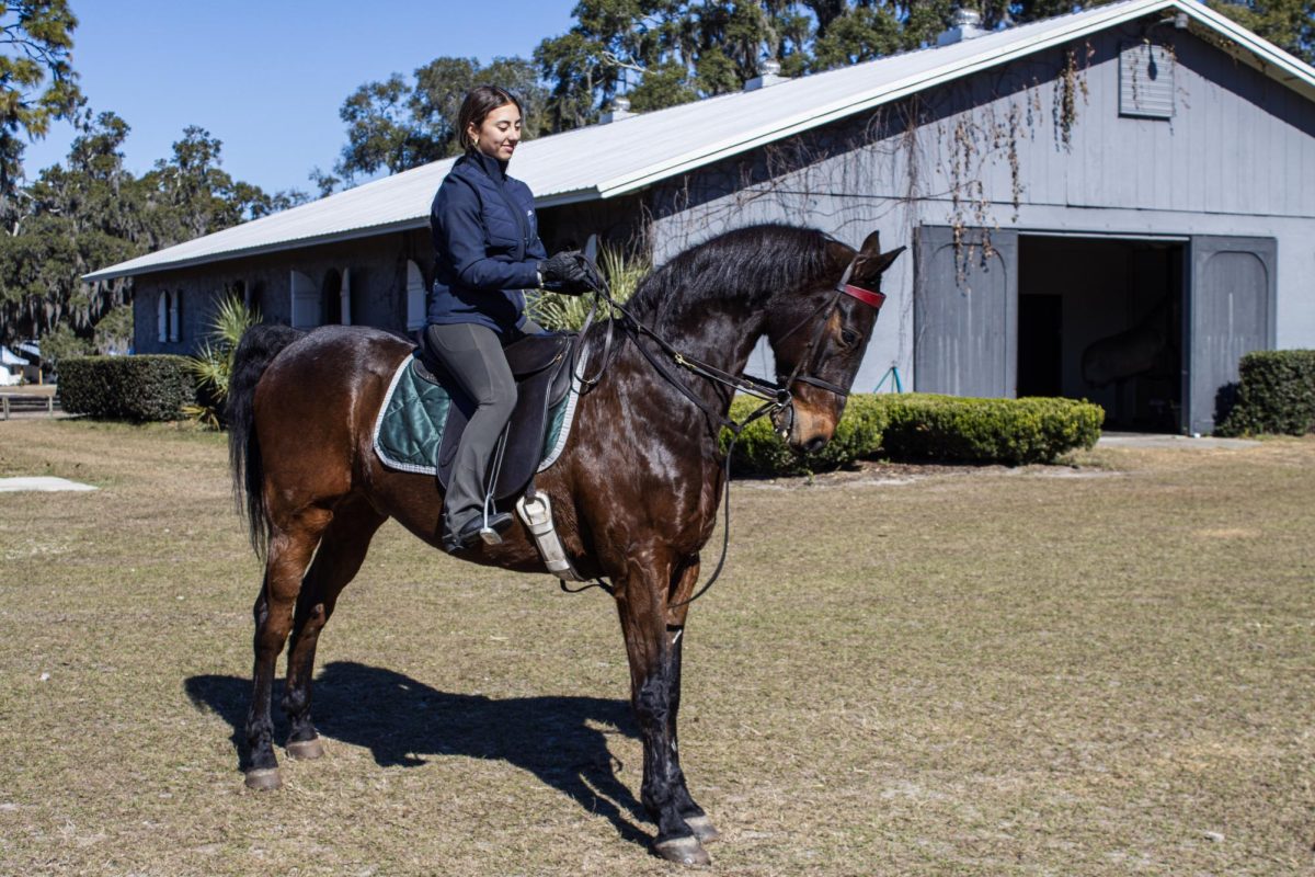 Freshman Addison Johnson rides her horse during saddle seat practice on Jan. 19. Johnson practices with two show horses named Bentley and Louie. 