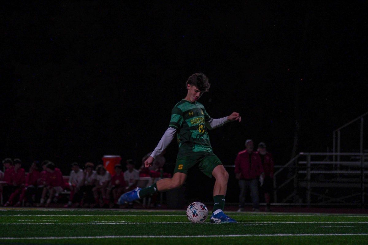 Freshman soccer player Billy Francis takes a penalty kick during a match against Clearwater Central Catholic in the district semifinals. Shorecrest won the match in penalty kicks