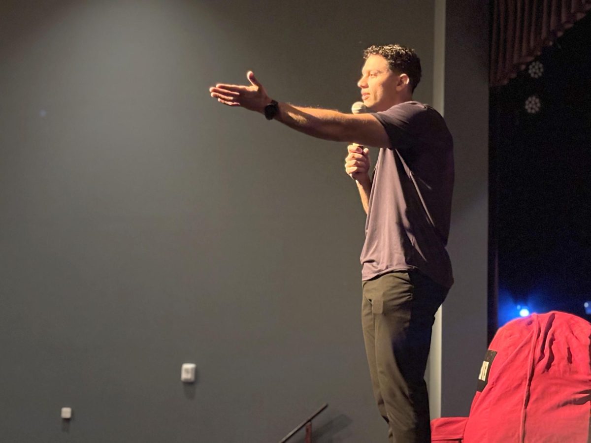 Author and motivational speaker Sam Demma speaks to the Upper School on Nov. 20, 2025 alongside his signature big red backpack. Demma will return to Shorecrest again in the spring. 