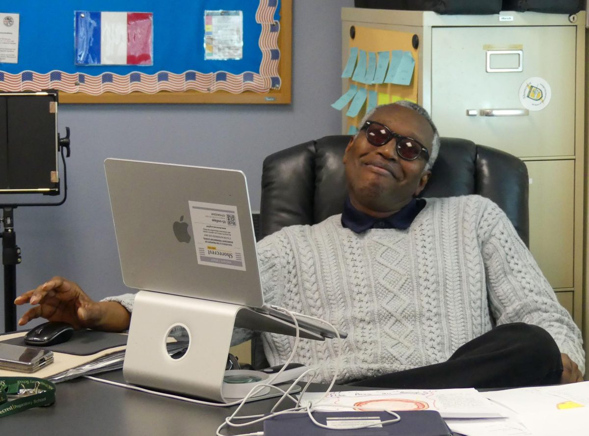 Upper School World Languages Teacher Sidy Ndiaye works on his computer during a planning period. After ten years of teaching at Shorecrest, Ndiaye has decided to retire after this school year.