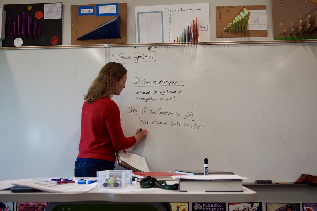 Upper School Math Teacher, US Math Department Chair Jessica Thorn teaches on the whiteboard. She teaches AB and BC Calculus. Photo by Ellen Hommeyer. 